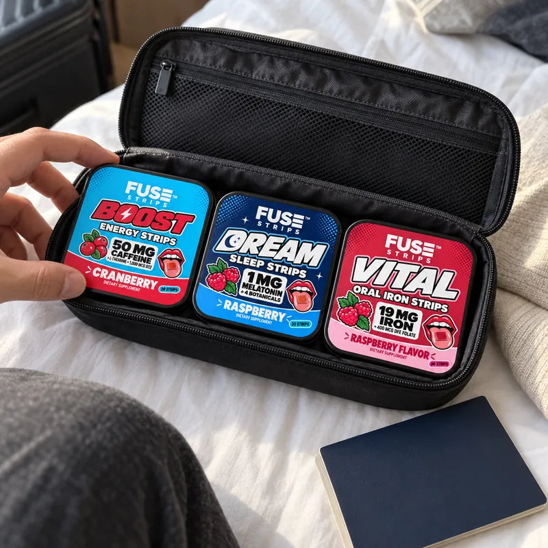 The Boost, Dream and Vital tins in a travel pouch on a hotel bed